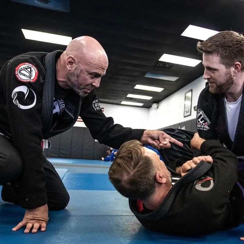 Brent Lillard coaching students on the mat at Gracie Charlottesville